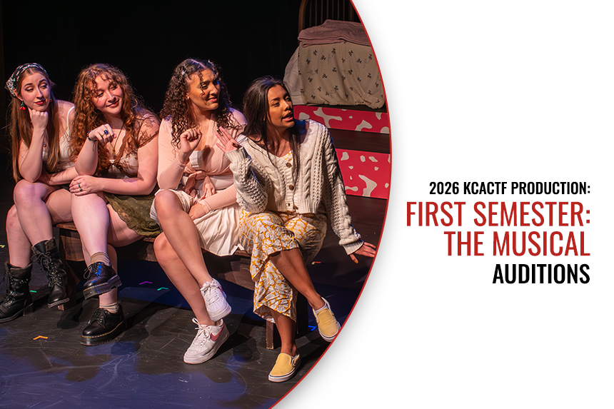 Performers seated on stage
